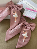 Personalised hair bow barrette with name and ballerina embroidery.